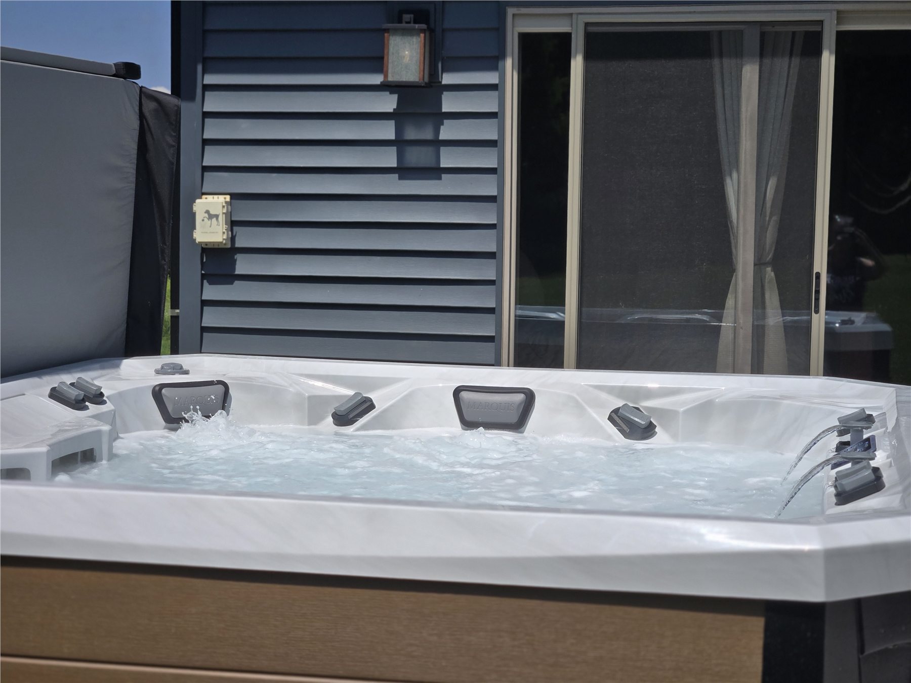 Seven-person hot tub on the back patio at Northern Lights Aurora